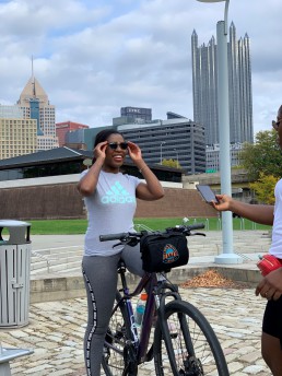 Mpande rides her bike in Pittsburgh