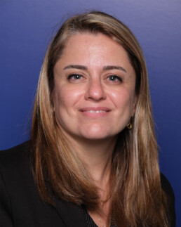 Headshot of a smiling woman.